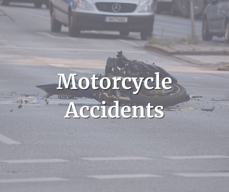 motorcycle in pieces laying in the road because of motorcycle accident. Their motorcycle accident attorney Tripp was nearby to help out